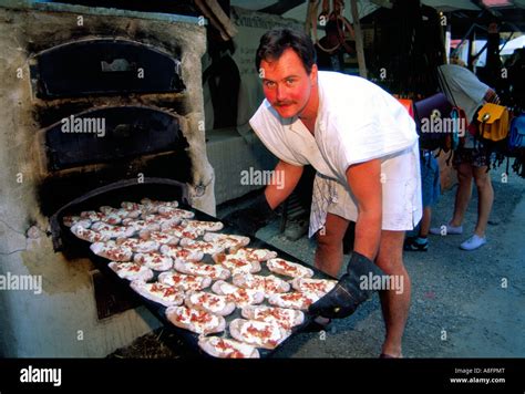 Baker baking bread in ancient style Medieval festival in Kaltenberg Bavaria Germany Stock Photo ...