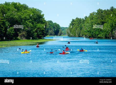 Recreational Kayak And Canoe Boaters On The Au Sable River In The