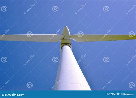 An Image Of Windturbine Generator In The Blue Sky Background Stock