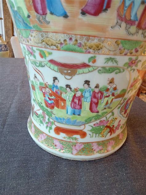 A Chinese Baluster Shaped Canton Famille Rose Vase With Palace Scenes