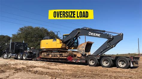 Kenworth Hauling Heavy Excavator Lowboy Side Loading And Unloading