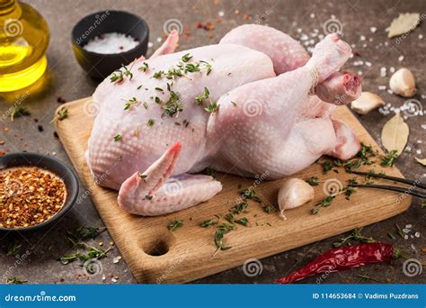 Fresh Raw Chicken On Cutting Board And Spices Stock Photo Image Of