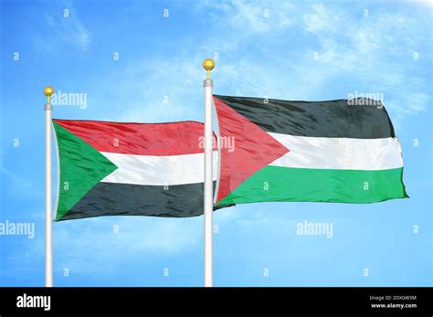 Sudan and Palestine two flags on flagpoles and blue sky Stock Photo - Alamy