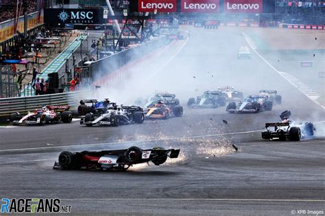 British GP Stopped After Zhou S Car Clears Tyre Barrier In Huge Start