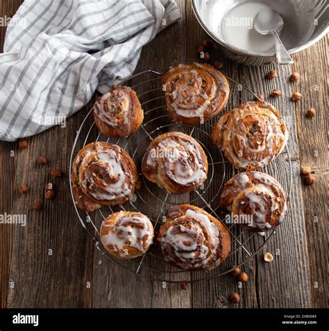 Homemade Cinnamon Rolls With Hazelnut Filling On A Cooling Rack On