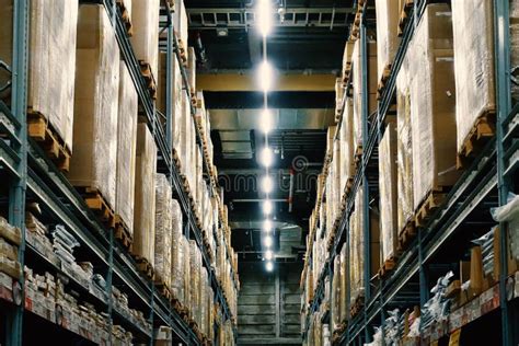 Large Wharehouse With Rows Of Shelves And Goods Boxes Stock Image