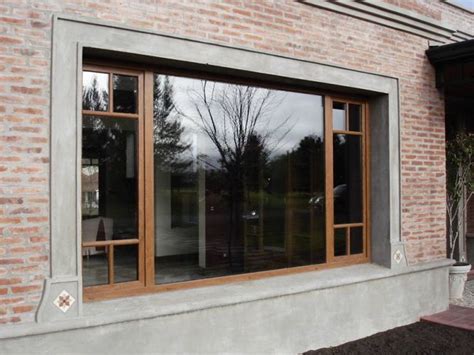 An Outside View Of A Brick Building With Large Windows