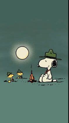 a cartoon dog sitting on top of a grass covered field next to a full moon