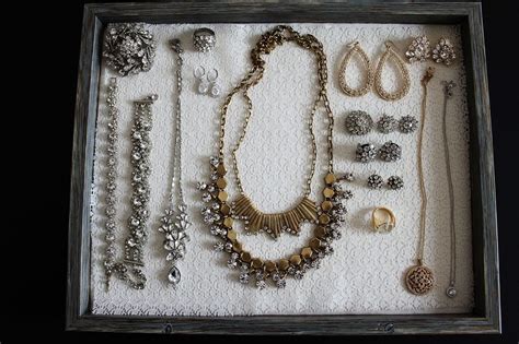 an assortment of jewelry is displayed in a box