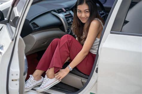 Premium Photo Portrait Of Smiling Mid Adult Woman Sitting In Car