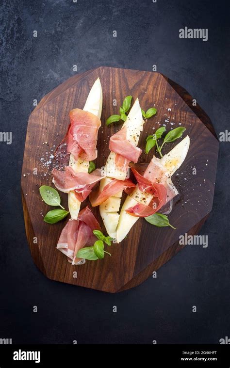 Traditional Italian Antipasti With Prosciutto Di Parma And Honeydew