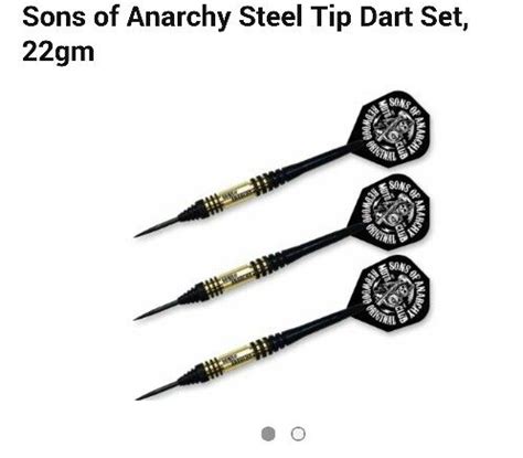 Three Black Darts With Gold Tips And Skull On The Front Two Are In