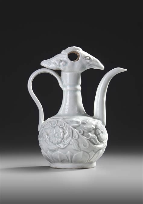 A CHINESE CARVED QINGBAI PHOENIX EWER SONG DYNASTY 960 1279