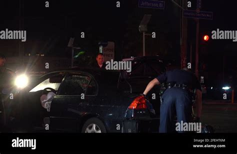 Lapd Searching Suspects Vehicle At Crime Scene Stock Video Footage Alamy