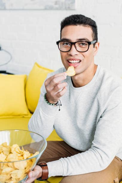 550 Young Man Eating Crisps Stock Photos Pictures And Royalty Free