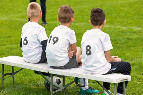 Boys Sitting on Soccer Football Wooden Bench. Kids Football Team Editorial Image - Image of ...