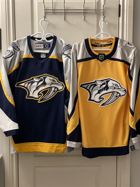 My two Preds jerseys old and new. Although I do love the old one more ...