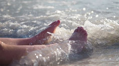 Girl S Legs On Sea Sand Seashore Splashing Water Wave Over Tanned