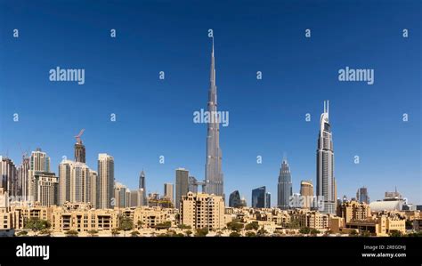 Dubai Skyline With Burj Khalifa Against Clear Blue Sky Stock Photo Alamy