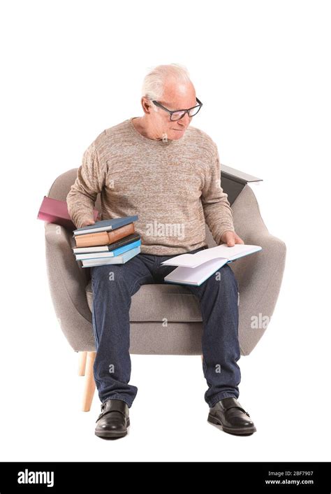 Portrait Of Elderly Man Reading Books On White Background Stock Photo