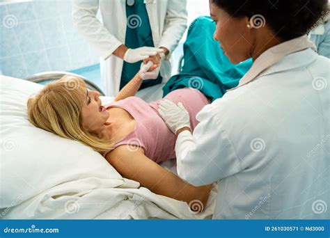 Pregnant Women In Labor Giving Birth