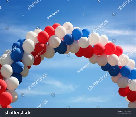 Red White And Blue Patriotic Balloon Arch Background Stock Photo