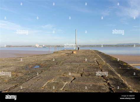 The harbour wall at Lydney Harbour on the West bank of the River Severn ...