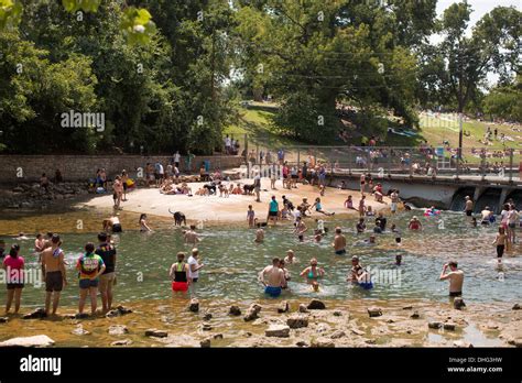 People Swim In The Outdoor Swimming Pool At Barton Springs Pool In