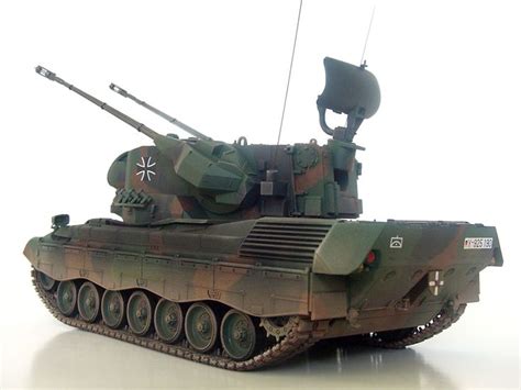 An Army Tank Is Shown On A White Surface