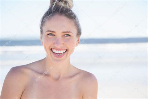 Pretty Smiling Blonde On The Beach Stock Photo Wavebreakmedia 48341009