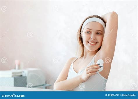 Woman Use Female Deodorant Portrait Of Young Woman Applies