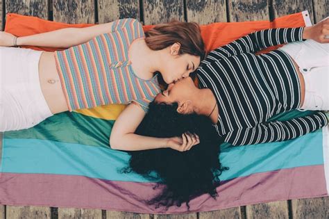Premium Photo Cute Lesbian Couple Lying Together On The Carpet