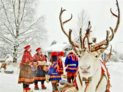 An indigenous Sami family preparing for their reindeer caravan ...