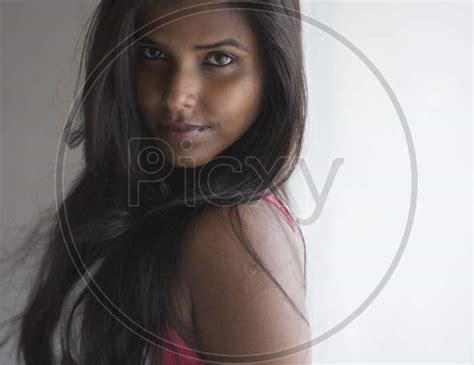 Image Of Portrait Of An Attractive Young Brunette Dark Skinned Indian Bengali Girl In Western