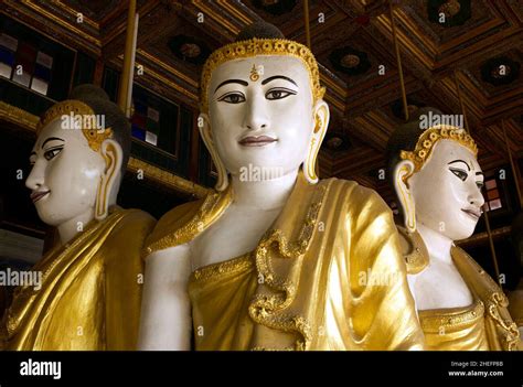 Colour Photograph Of Three Buddha Statues Inside Kyaikthanian Paya