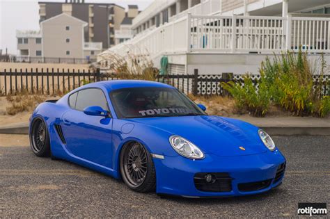 Electric Blue Porsche Cayman With Air Suspension on Black Rotiform ...