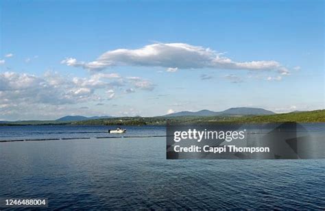 Rangeley Lake In Rangeley Maine Usa With Boat Crossing Lake On Summer