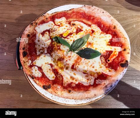 Margarita pizza with basil Stock Photo - Alamy