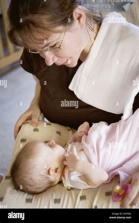 A mother and newborn daughter bonding Stock Photo - Alamy