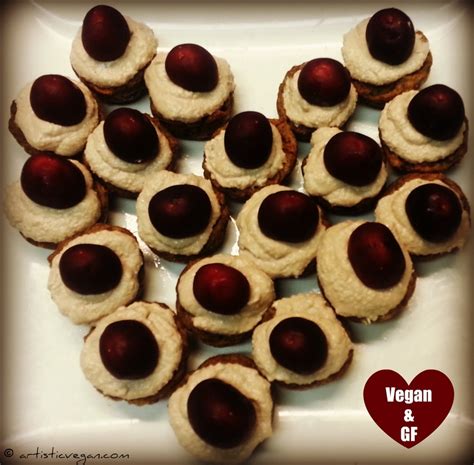 Vanilla Mango Muffins With Coconut Frosting And A Cherry On Top