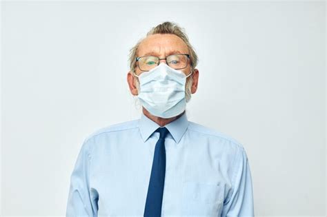 Premium Photo Portrait Of Man Wearing Mask Against White Background