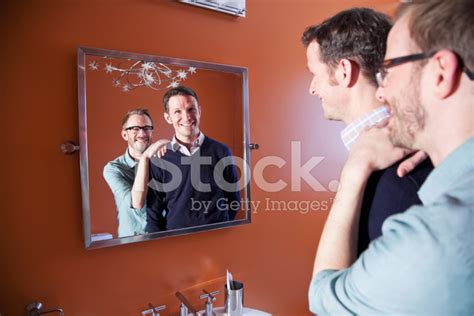 Foto De Stock Pareja Gay Mirando En El Espejo Libre De Derechos FreeImages