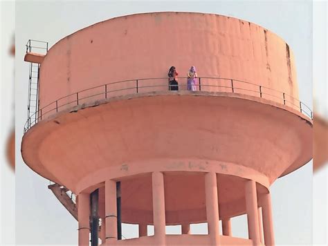 Two Women Climbed On The Water Tank To Open The Road Closed For A Year