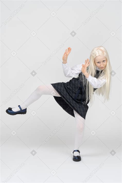 Schoolgirl Trying To Get Away And Putting Hands Up Photo