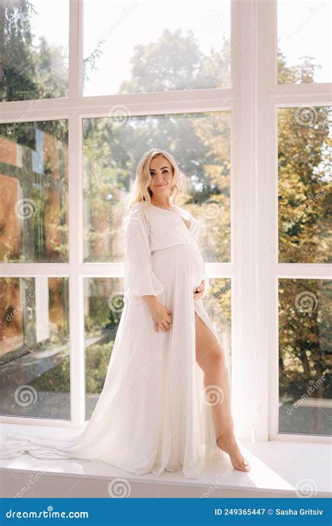 Beautiful Portrait Of Pregnant Woman In White Dress Concept Of Perfect