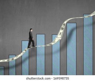 Businessman Walking On Growth Money Trend Stock Photo