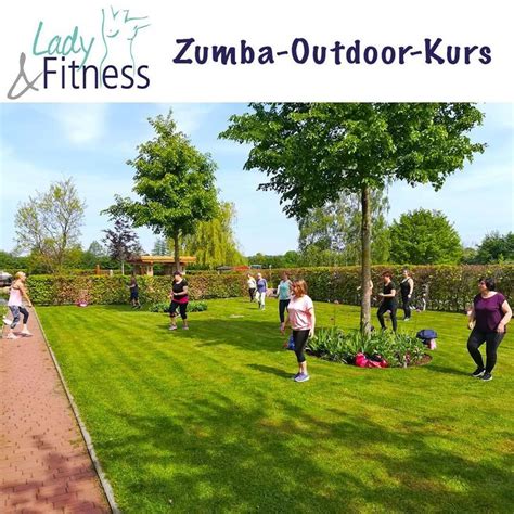 A Group Of People Doing Exercises In The Grass On A Sunny Day With