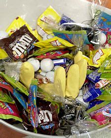 a bowl filled with assorted candy and candies