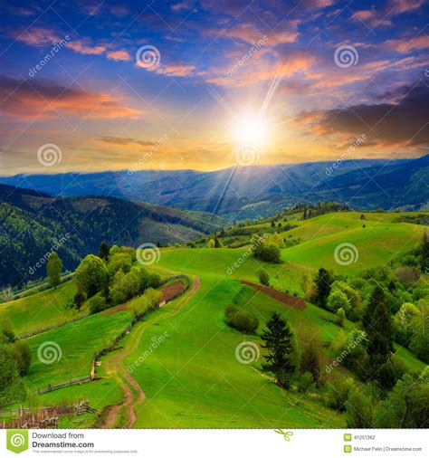 Fence On Hillside Meadow In Mountain At Sunset Stock Photo Image Of