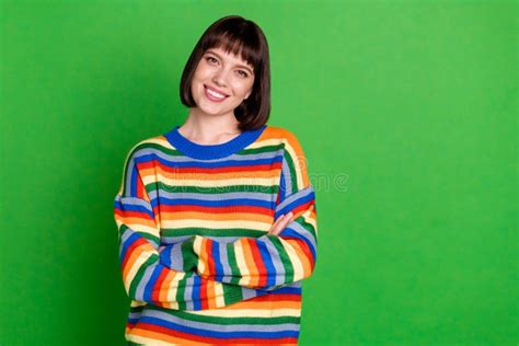 Photo Of Pretty Adorable Young Woman Wear Striped Sweater Smiling Arms